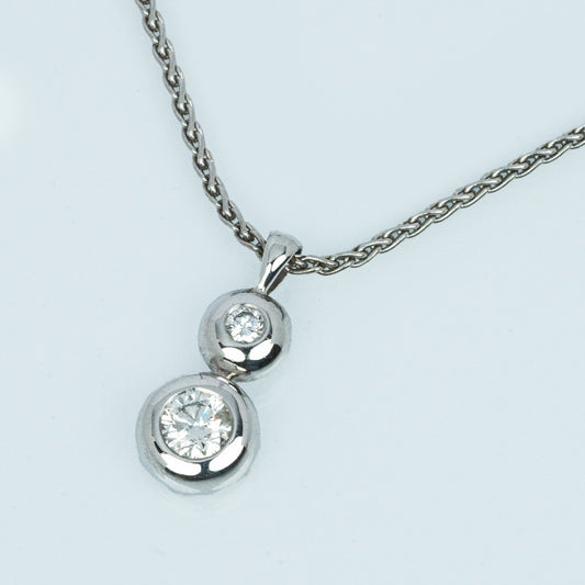 18 carat white gold diamond double bezel set solitaire pendant
