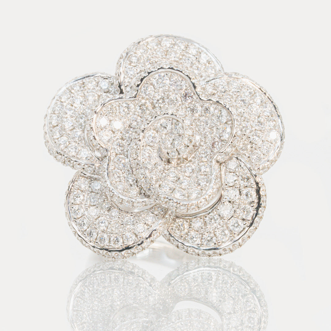 18 carat white gold pave set diamond flower ring