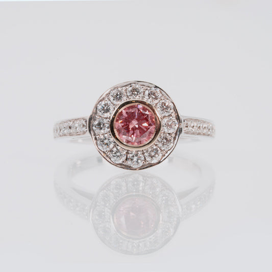 18 carat white gold lab grown pink and white diamond halo and band engagement ring