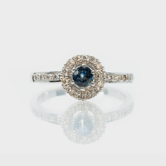18 carat white gold sapphire and halo diamond dress ring